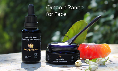 two skincare products in a natural setting and the writing Organic Range for Face