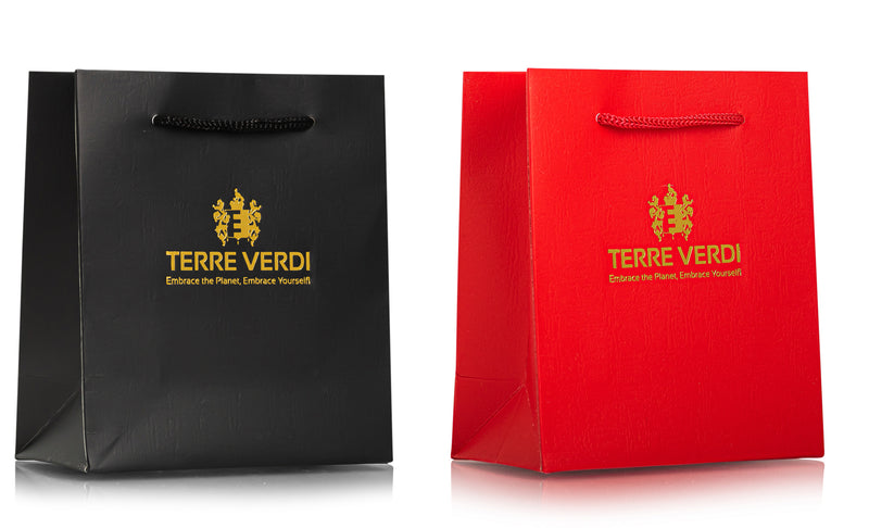 two gift bags one black and one red with Terre Verdi Embrace the Planet, Embrace Yourself written on them